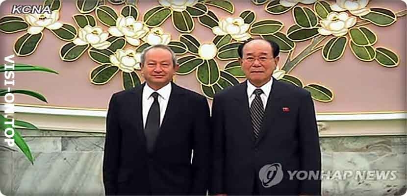 رئيس أوراسكوم نجيب أنسي ساويرس ورئيس مجلس الشعب الأعلى كيم يونغ نام